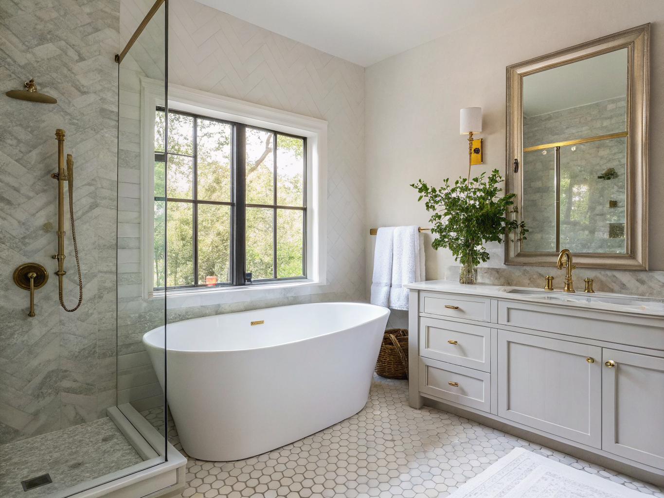 Spa primary bathroom with brass fixtures and freestanding soaking tub in Winnona Park